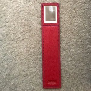 Coach leather book market